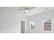 Bright bedroom features neutral carpet, ceiling fan, and large windows at 102 Brackley Dr, Cumming, GA 30040
