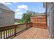 A wide wooden deck showcases a private outdoor space with views of lush landscaping at 102 Brackley Dr, Cumming, GA 30040