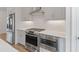 Close-up of a stylish kitchen with stainless steel appliances and sleek countertops at 102 Brackley Dr, Cumming, GA 30040