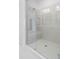 Glass enclosed shower with seating and tiled surround at 102 Brackley Dr, Cumming, GA 30040