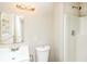 Bright bathroom featuring a new vanity, toilet, and a shower with white walls at 1947 Main St, Atlanta, GA 30318