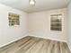 Clean bedroom with wood floors, neutral paint, and natural light coming through the windows at 1947 Main St, Atlanta, GA 30318