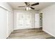 Bright bedroom features wood floors, ceiling fan, and French doors leading to the outside at 1947 Main St, Atlanta, GA 30318