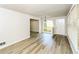 Bright living room with neutral walls, hardwood floors, and an arched window providing natural light at 1947 Main St, Atlanta, GA 30318