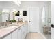 Bright bathroom featuring a double vanity, quartz countertops, and glass shower at 332 Gibson Se St, Atlanta, GA 30316