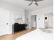Bright bedroom with hardwood floors and a dresser, offering easy access to ensuite bathroom at 332 Gibson Se St, Atlanta, GA 30316