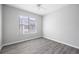 Comfortable bedroom featuring a window for natural light and wood-look flooring at 5300 Peachtree Rd # 2309, Chamblee, GA 30341