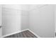 Spacious walk-in closet with white wire shelving and grey wood-look flooring at 5300 Peachtree Rd # 2309, Chamblee, GA 30341