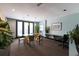 Community common room features a large table, chairs, and greenery at 5300 Peachtree Rd # 2309, Chamblee, GA 30341