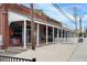Exterior of a commercial building with outdoor seating and a storefront at 5300 Peachtree Rd # 2309, Chamblee, GA 30341
