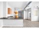 Bright open concept kitchen featuring granite countertops, wood cabinets, and stainless steel sink at 5300 Peachtree Rd # 2309, Chamblee, GA 30341