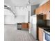 Sleek kitchen with stainless steel appliances, granite countertops, and light wood cabinetry at 5300 Peachtree Rd # 2309, Chamblee, GA 30341