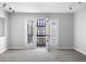 Inviting living space with wood-look floors and balcony access, offering a seamless indoor-outdoor flow at 5300 Peachtree Rd # 2309, Chamblee, GA 30341