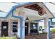 Charming exterior of The Blue Top with brick facade, blue trim, and inviting signage at 5300 Peachtree Rd # 2309, Chamblee, GA 30341