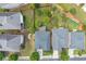 Bird's eye view of homes showing roofs, driveways, lawns and mature trees in a residential neighborhood at 812 Autry Oak Ct, Alpharetta, GA 30022