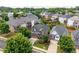 Aerial view showcases well-maintained homes with manicured lawns and mature trees in a suburban neighborhood at 812 Autry Oak Ct, Alpharetta, GA 30022