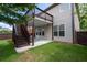 The backyard features a grassy lawn and a staircase leading to a second story deck at 812 Autry Oak Ct, Alpharetta, GA 30022