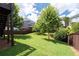 View of backyard with grass and trees at 812 Autry Oak Ct, Alpharetta, GA 30022