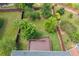 Aerial view of backyard with wooden deck, green lawn, playground equipment, and fenced perimeter at 812 Autry Oak Ct, Alpharetta, GA 30022