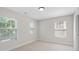Neutral bedroom features natural light from windows and neutral carpet at 812 Autry Oak Ct, Alpharetta, GA 30022