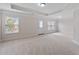 Spacious bonus room with neutral carpet, windows, trey ceiling, and access to back yard at 812 Autry Oak Ct, Alpharetta, GA 30022