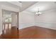Formal dining room with hardwood floors, decorative molding, chandelier and natural light at 812 Autry Oak Ct, Alpharetta, GA 30022