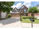 Two-story brick home with a two-car garage, a mailbox and landscaping at 812 Autry Oak Ct, Alpharetta, GA 30022