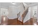 Hallway with staircase, hardwood floors and white trim at 812 Autry Oak Ct, Alpharetta, GA 30022
