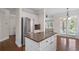 Kitchen with center island, stainless steel refrigerator, and eat-in area at 812 Autry Oak Ct, Alpharetta, GA 30022