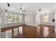 Hardwood living room featuring large windows and natural light at 812 Autry Oak Ct, Alpharetta, GA 30022