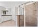 Main bathroom with double sink vanity, a glass enclosed shower, and tile flooring at 812 Autry Oak Ct, Alpharetta, GA 30022