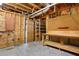Unfinished basement featuring a work bench, storage and door to another room at 1552 Brentwood Dr, Marietta, GA 30062