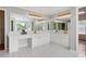 Bright bathroom featuring double vanity, and elegant gold fixtures and hardware at 1552 Brentwood Dr, Marietta, GA 30062
