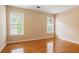 Large bedroom with hardwood floors and plenty of natural light at 1552 Brentwood Dr, Marietta, GA 30062