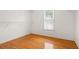 Walk in closet with hardwood flooring and one window at 1552 Brentwood Dr, Marietta, GA 30062