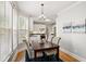 Bright dining area features a table for four, with white kitchen appliances in the background at 1552 Brentwood Dr, Marietta, GA 30062