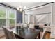 Elegant dining room with large windows and view to the living room at 1552 Brentwood Dr, Marietta, GA 30062