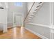 Bright foyer featuring hardwood floors, staircase, and a view of the front door at 1552 Brentwood Dr, Marietta, GA 30062