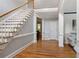 Open foyer with hardwood floors, staircase, and classic moldings at 1552 Brentwood Dr, Marietta, GA 30062