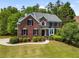 Traditional brick home with well-manicured lawn, tasteful landscaping, and inviting entrance at 1552 Brentwood Dr, Marietta, GA 30062