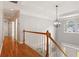 Light-filled hallway with hardwood floors and decorative lighting at 1552 Brentwood Dr, Marietta, GA 30062