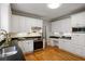 Well-lit kitchen with stainless steel appliances and ample cabinet space at 1552 Brentwood Dr, Marietta, GA 30062