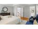 Spacious bedroom featuring stylish decor, a king bed, and hardwood floors at 1552 Brentwood Dr, Marietta, GA 30062