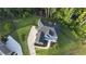 Aerial view of a home showcasing its expansive lot, mature trees, well-maintained landscaping, and a private backyard at 1895 Henley Way, Alpharetta, GA 30009
