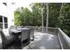 Spacious back deck with outdoor seating and dining furniture, perfect for entertaining at 1895 Henley Way, Alpharetta, GA 30009