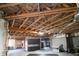 Unfinished basement featuring high ceilings, exposed wood beams, and plenty of room for customization at 1895 Henley Way, Alpharetta, GA 30009