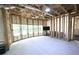 Unfinished basement with framed walls and windows; ready for customization at 1895 Henley Way, Alpharetta, GA 30009