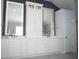Bathroom featuring double vanity, illuminated mirrors, marble countertops, and modern cabinetry at 1895 Henley Way, Alpharetta, GA 30009