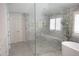 Large glass shower with built-in bench, along with standalone soaking tub at 1895 Henley Way, Alpharetta, GA 30009