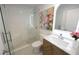 Bathroom featuring a glass shower, herringbone tile floor, and marble sink and countertop at 1895 Henley Way, Alpharetta, GA 30009
